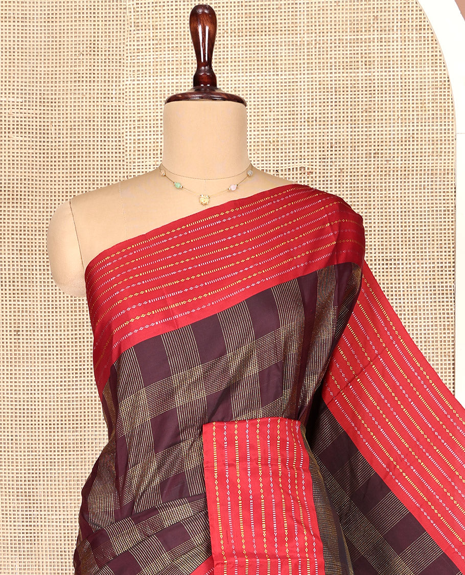 Maroon Aarani Gift Saree, Elevated with Checks on Its Body, Complemented by a Contrast Zari Striped Border, a Pallu of Zari Designs, and Paired with a Matching Blouse