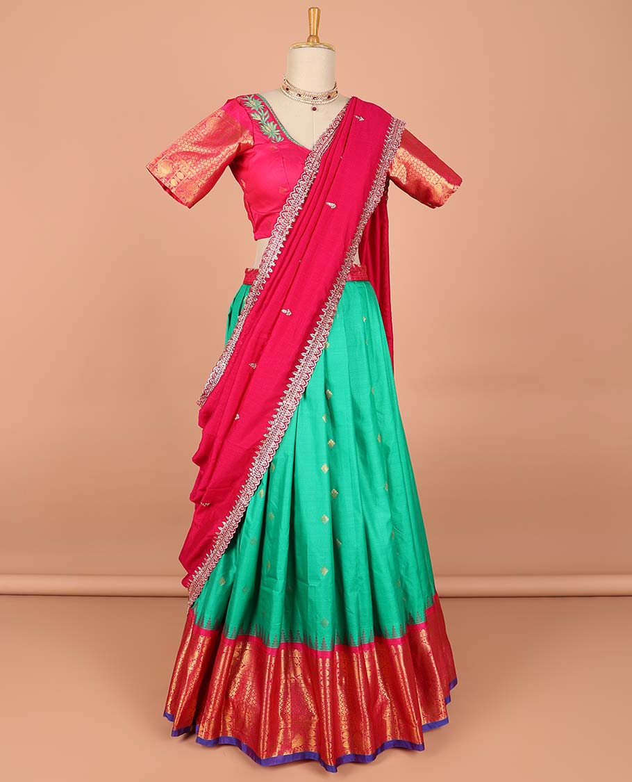 Green buttas semi-stitched half saree with contrast zari border, embroidered blouse & scallop border dhavani