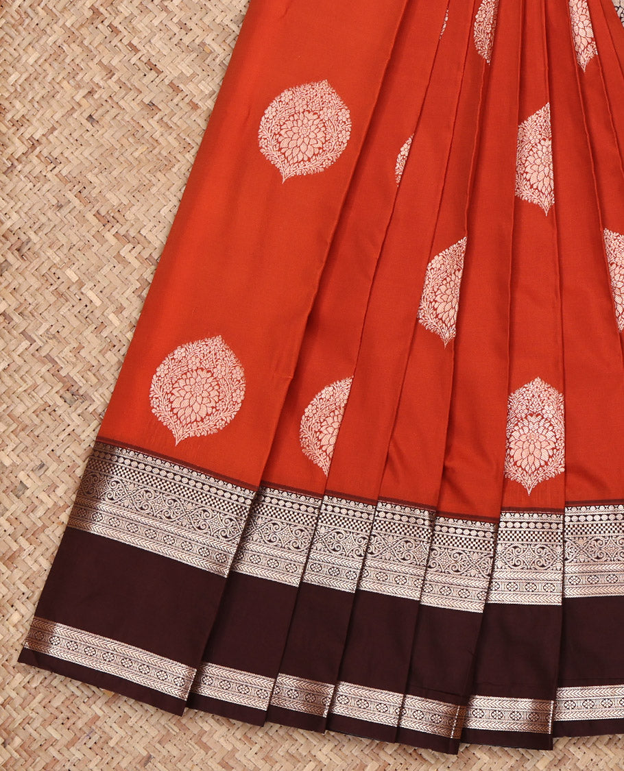 Rust Budget Silk Saree, Detailed with Zari Buttas All Over Its Body, Complemented by a Contrast Traditional Zari Design Rettai Pettu Border, Pallu of Mughal-Style Floral Designs, and Paired with a Contrast Blouse