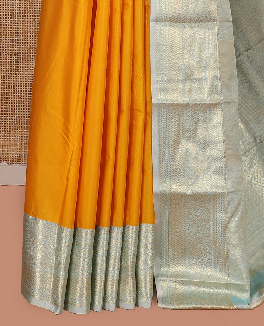 Yellow Budget Silk Saree, Sparsely Threaded with Zari Buttas on Its Body, Complemented by a Contrast Traditional Zari Design Border, Grand Zari Woven Pallu, and Paired with a Contrast Blouse