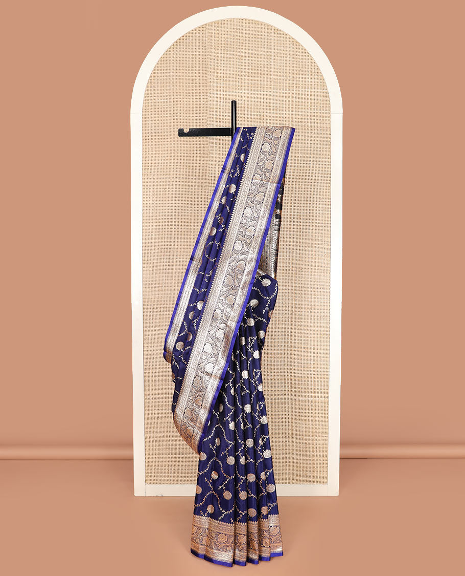 Navy blue floral jaal jacquard banarasi silk saree, contrast floral creeper design border, and intricate ogee patterned pallu