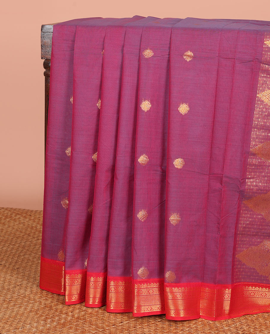 Magenta Chettinad Cotton Saree Ornamented with Zari Buttas All Over Its Body, Complemented by a Contrast Border of Traditional Zari Designs, and Pallu Embellished with Intricate Zari Designs