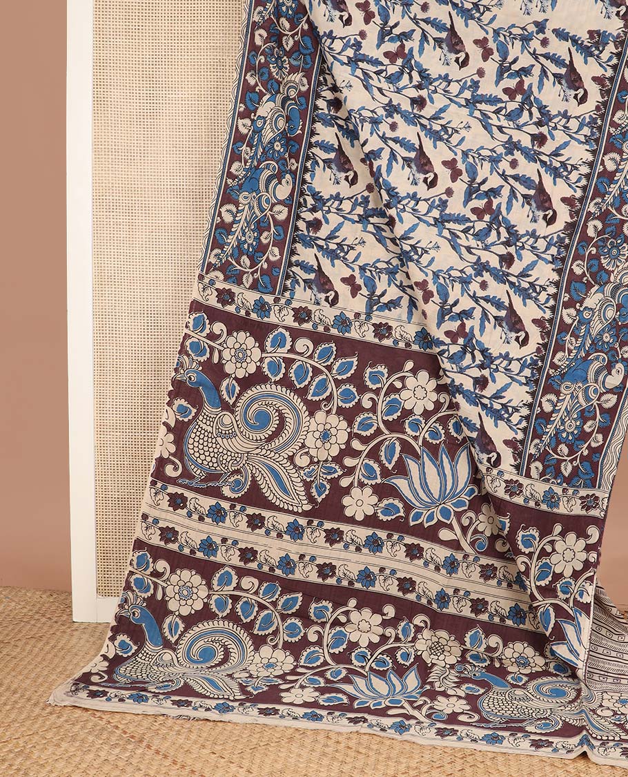 Cream floral, and sparrow machine printed kalamkari cotton saree, contrast floral-peacock border, and pallu of peacocks print