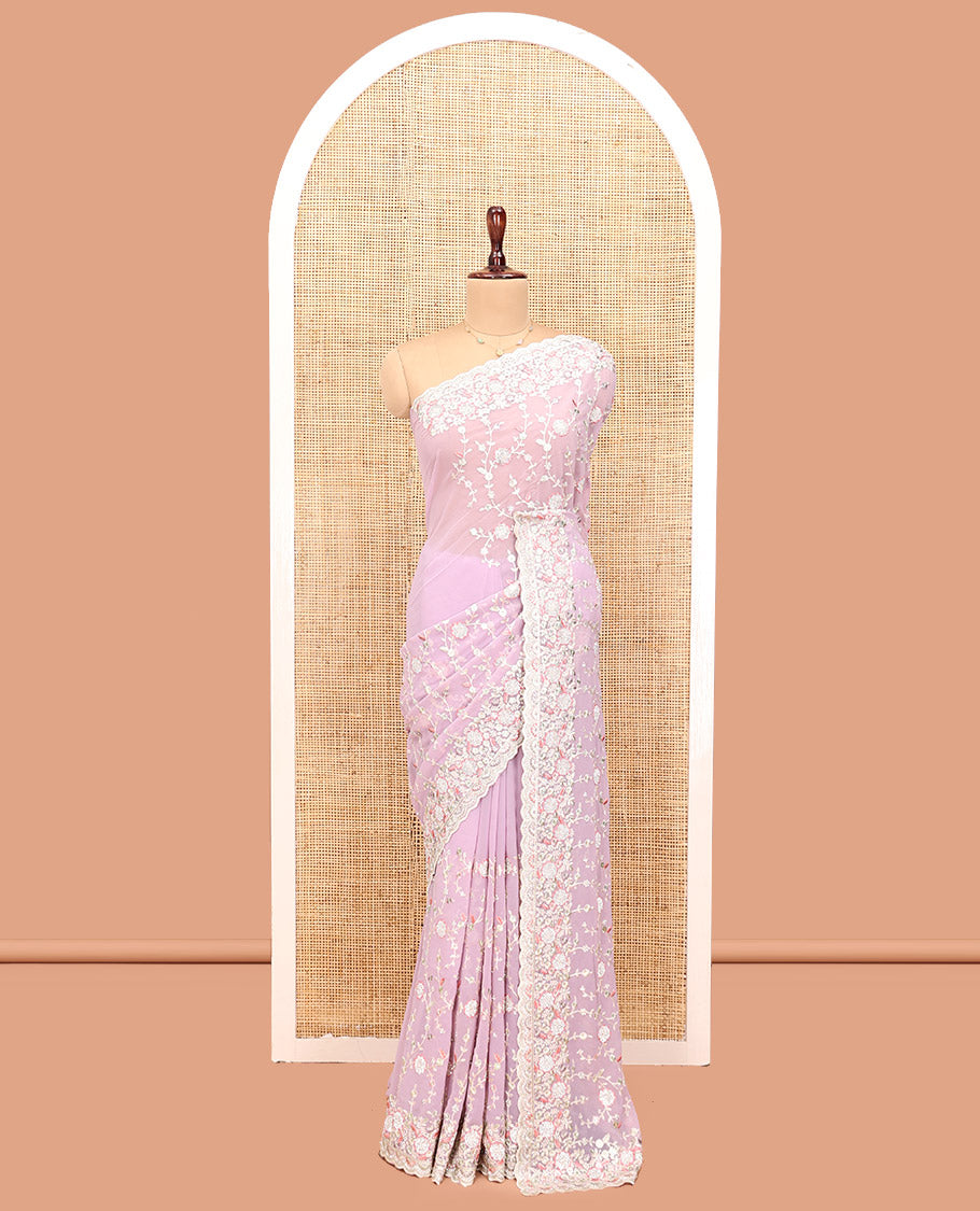 Pale Pink Designer Saree, Beautifully Bedecked with Floral Vine Embroidery, a Scallop Embroidered Border, and a Matching Blouse
