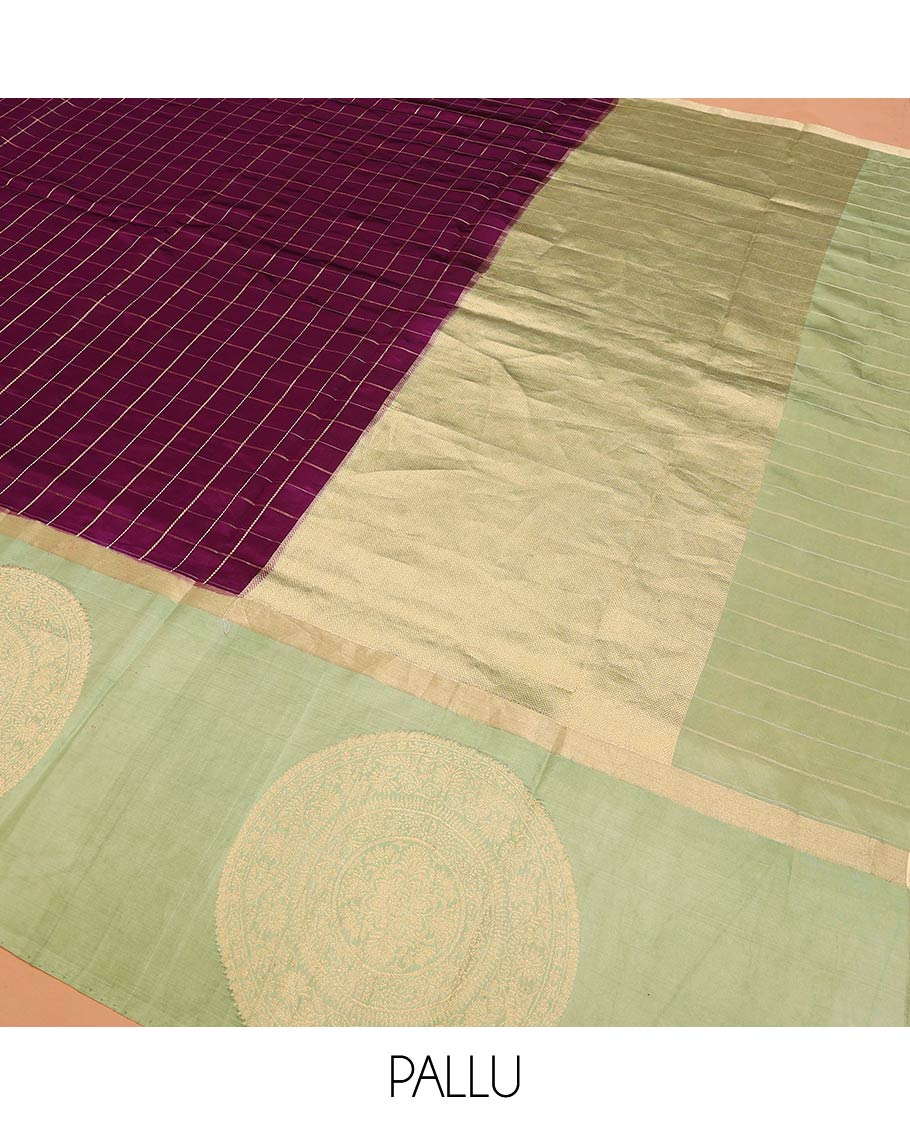 Purple Raw Mango Silk Saree Enthralled with Checks, Features a Contrast Chakram Motifs Border, a Zari-Elevated Pallu, and Paired with a Contrast Blouse