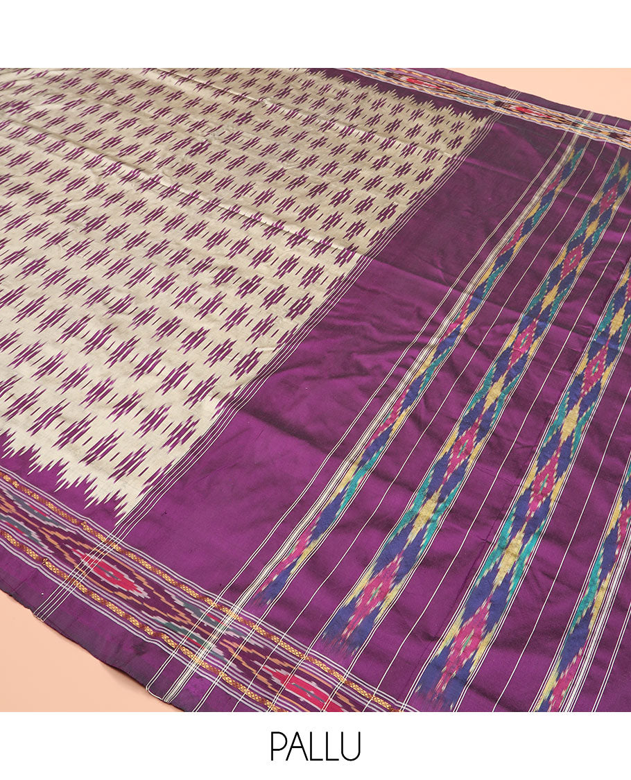 Grey Ikkat Silk Saree Highlighted with Ikkat Buttas, Featuring a Contrast Ikkat Temple Border in Ikkat Weave, and a Pallu Showcasing Ikkat Texture and Stripes