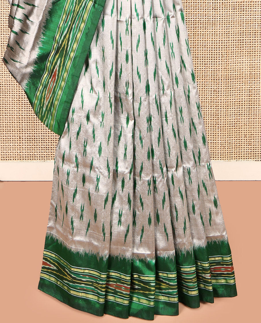 Grey-Green Pochampally Ikat Silk Saree, Adorned with Ikat Buttas, Complemented by a Contrast Ikat Border, Ikat-Style Pallu, and No Blouse