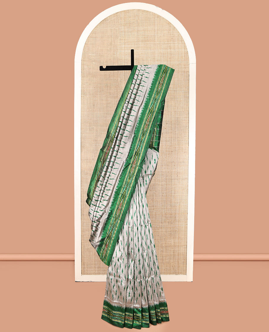 Grey-Green Pochampally Ikat Silk Saree, Adorned with Ikat Buttas, Complemented by a Contrast Ikat Border, Ikat-Style Pallu, and No Blouse