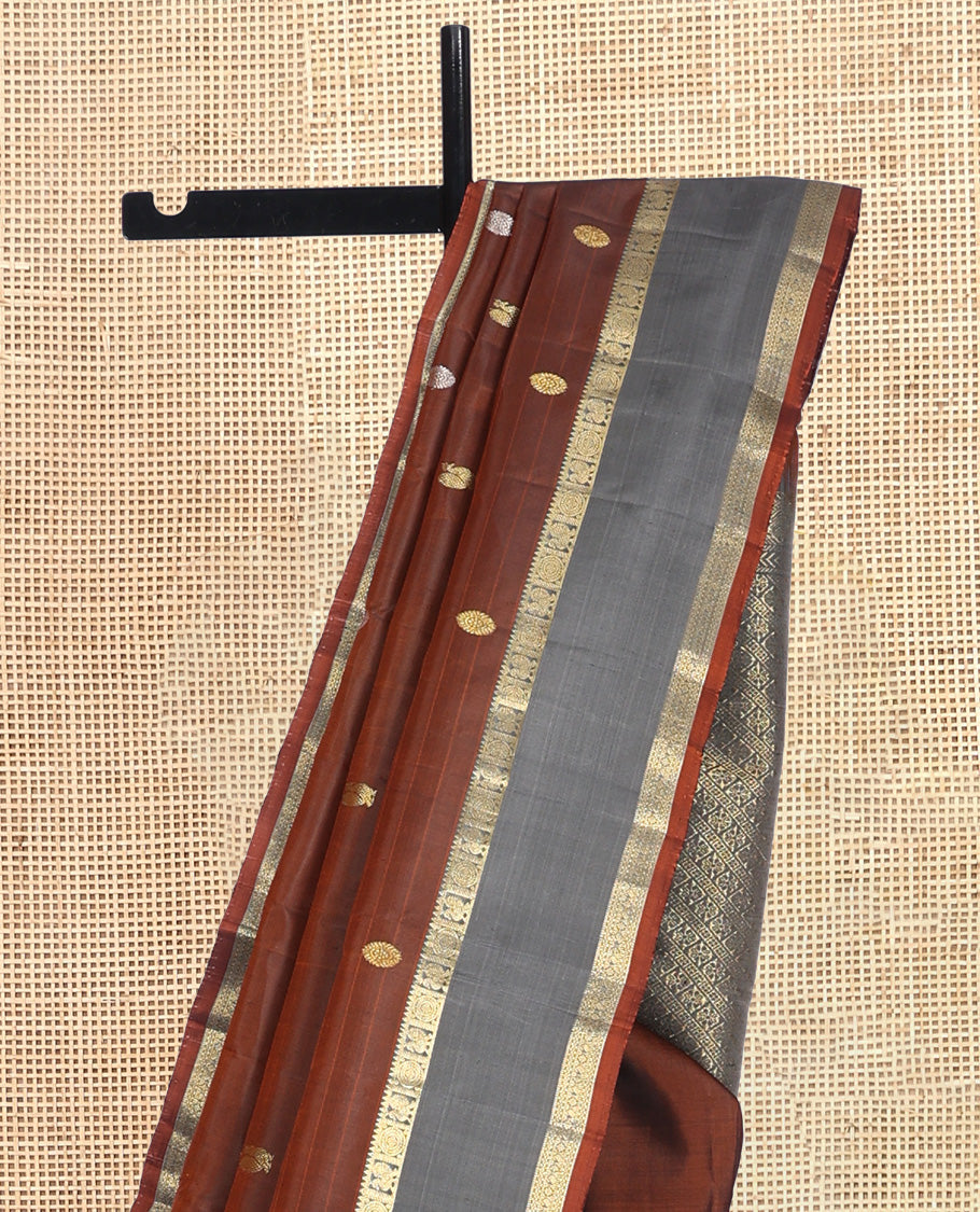 Brown Kanchipuram Silk Saree, Artfully Detailed with Mayil-Chakram Buttas, a Contrast Rettai Pettu Border of Mayil and Chakram Designs, Jaal Pallu, and a Contrast Blouse