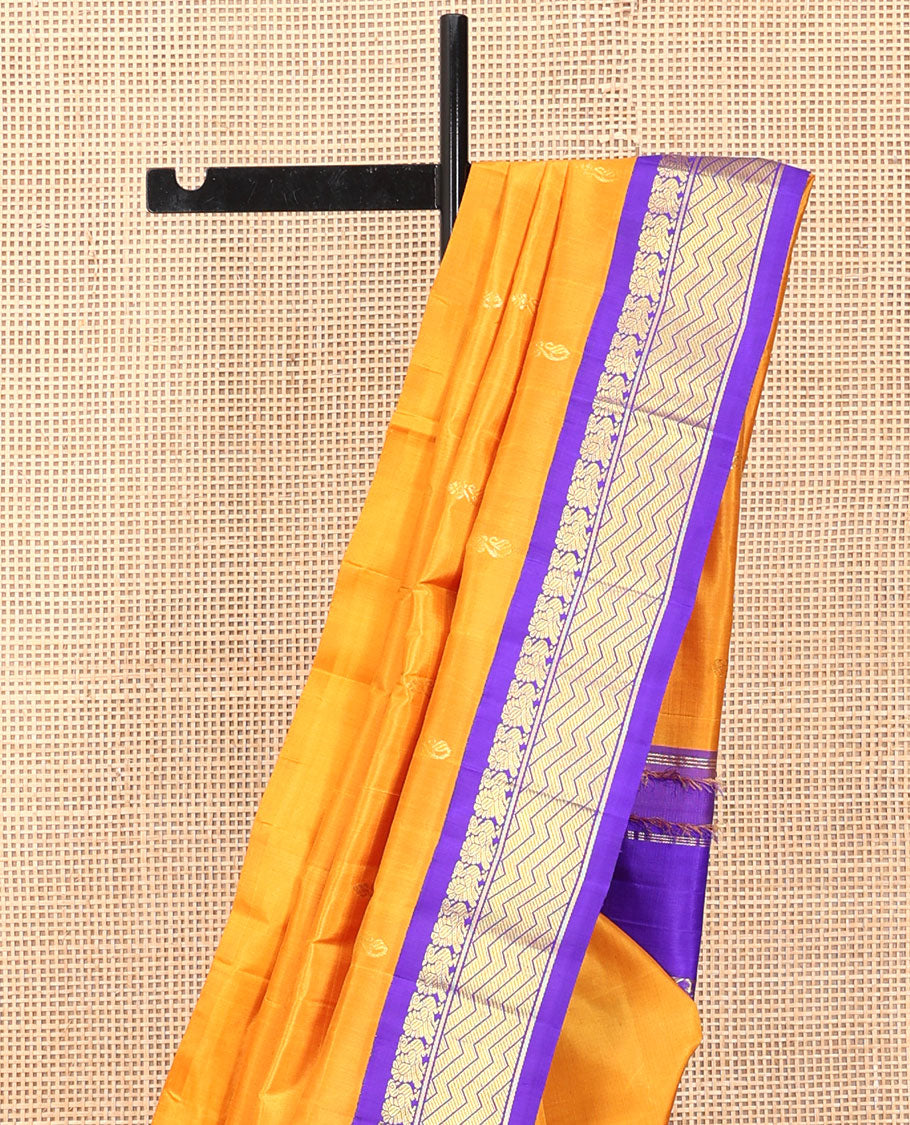 Yellow Kanchipuram Silk Saree, Subtly Sparkled with Zari Buttas, a Contrast One-Sided Korvai Border of Mayil Designs, a Floral Design Pallu, and No Blouse