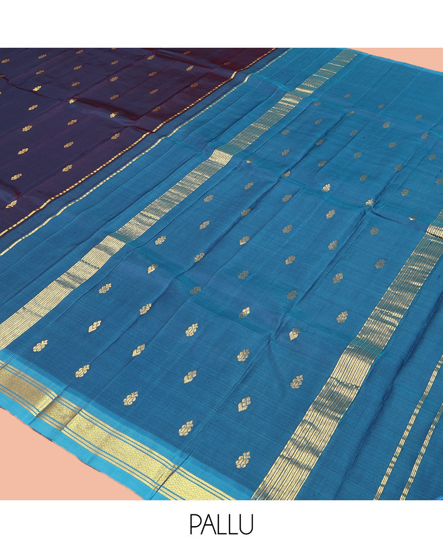 Navy Blue Kanchipuram Silk Saree, Beautifully Bedecked with Zari Buttas on Its Body, Complemented by Contrast One-Sided Border of Banaras, and Jaal Designs, Pallu Features Zari Designs, and Comes Without a Blouse