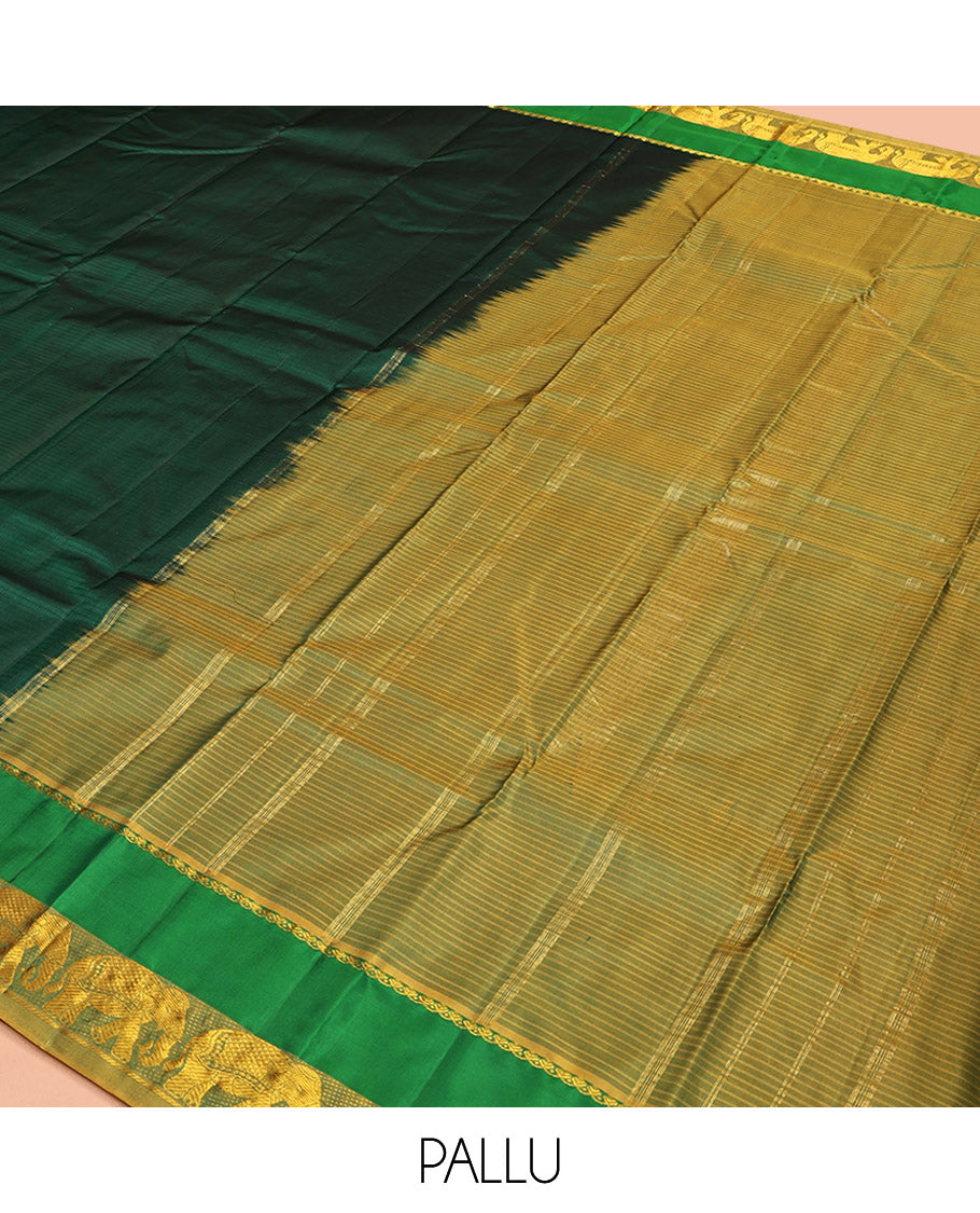 Green Kanchipuram Silk Saree, Sparsely Woven with Vazhaipoo Stripes on Its Body, Complemented by Contrast Rettai Pettu Border of Salngai, and Yaanai Designs, Zari-Striped Pallu, and Paired with a Contrast Blouse