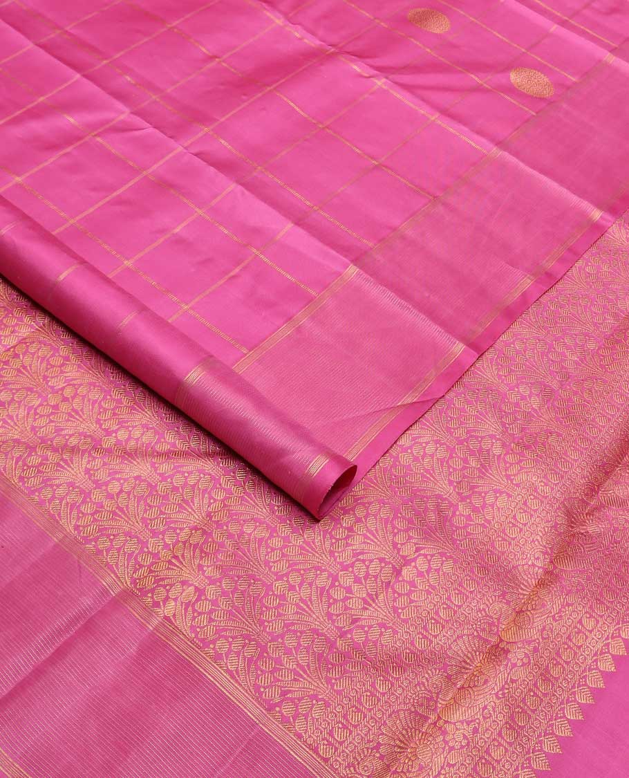 Pink annam chakram buttas enclosed checked Kanchipuram silk saree, zari border of stripes, and pallu of scallop designs