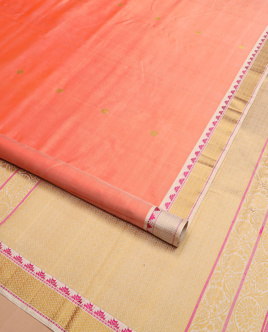 Peach rudraksham buttas Kanchipuram silk saree, contrast border of thazampoo rekku, muthu, and vanki designs, and jaal pallu