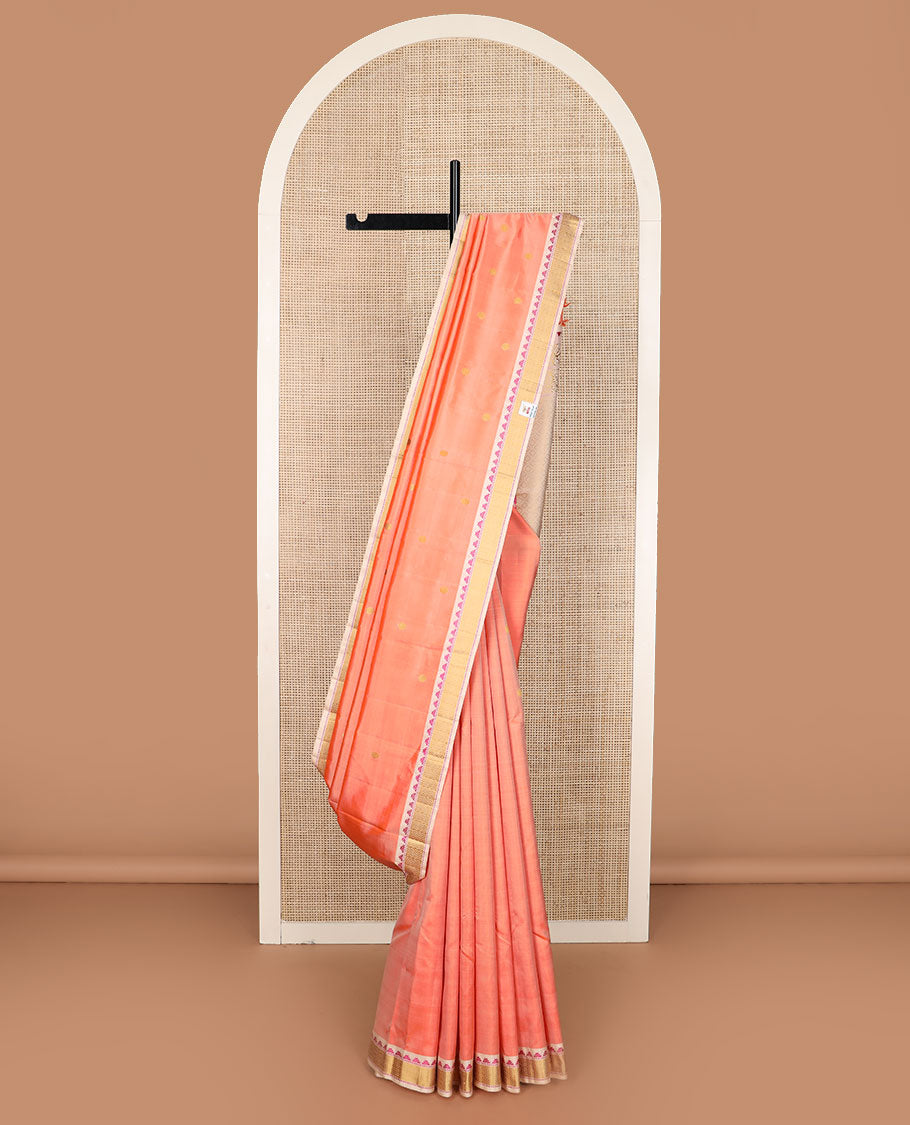 Peach rudraksham buttas Kanchipuram silk saree, contrast border of thazampoo rekku, muthu, and vanki designs, and jaal pallu