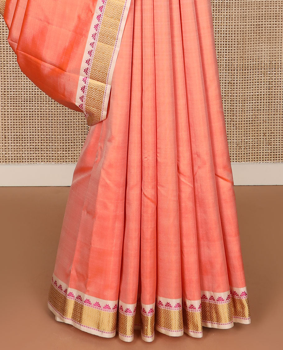 Peach rudraksham buttas Kanchipuram silk saree, contrast border of thazampoo rekku, muthu, and vanki designs, and jaal pallu