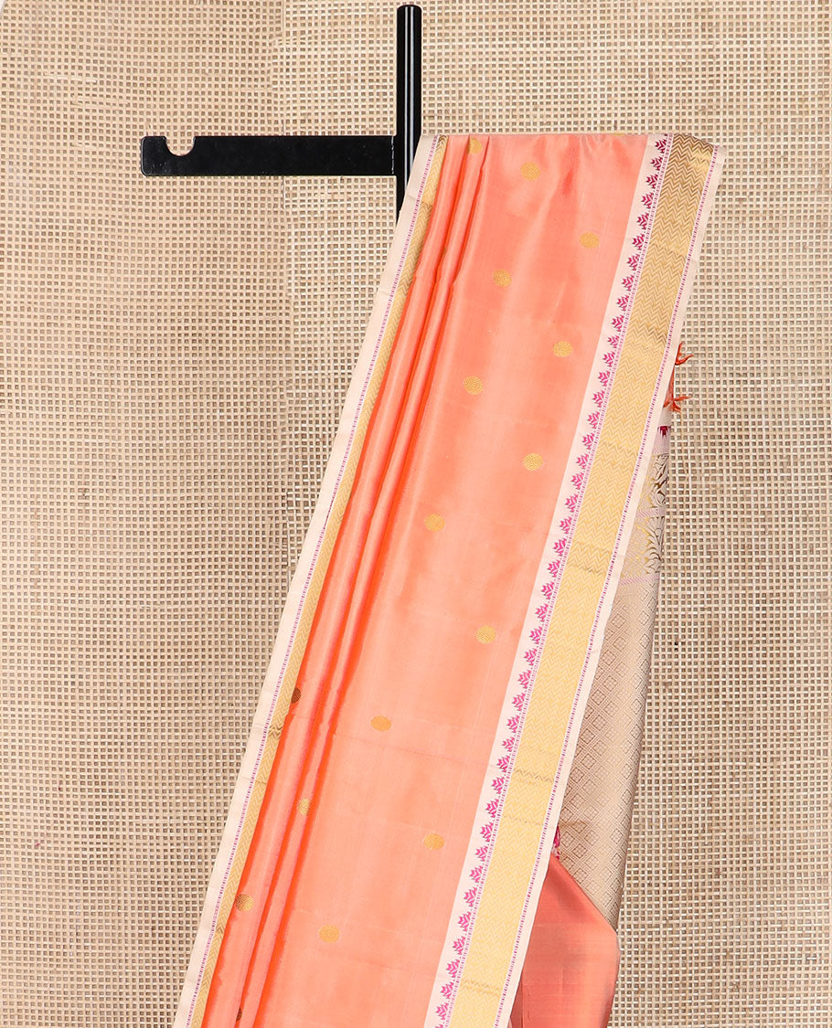 Peach rudraksham buttas Kanchipuram silk saree, contrast border of thazampoo rekku, muthu, and vanki designs, and jaal pallu