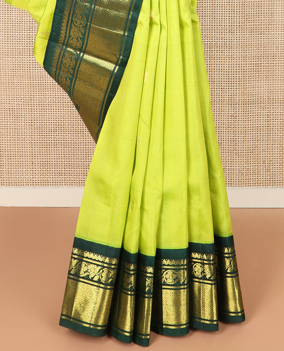 Green zari buttas Kanchipuram silk saree, contrast korvai border of thilakam mokku, kodi visiry, and jaal designs, and pallu of ancient human figurines