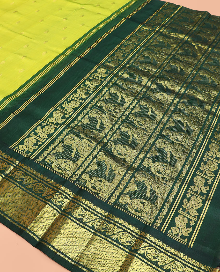 Green zari buttas Kanchipuram silk saree, contrast korvai border of thilakam mokku, kodi visiry, and jaal designs, and pallu of ancient human figurines