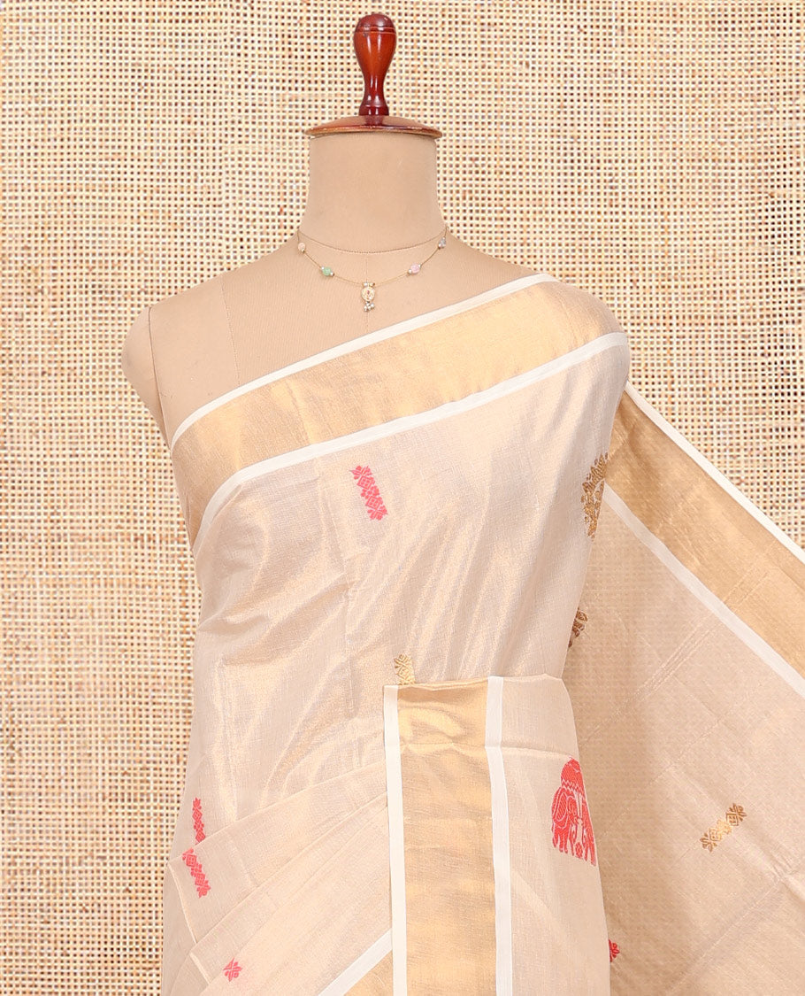 Cream Kerala Cotton Saree, Delicately Woven with Thread and Zari Buttas All Over Its Body, a Zari Bavanji Border, Pallu of Elephant Designs, and Paired with a Matching Blouse