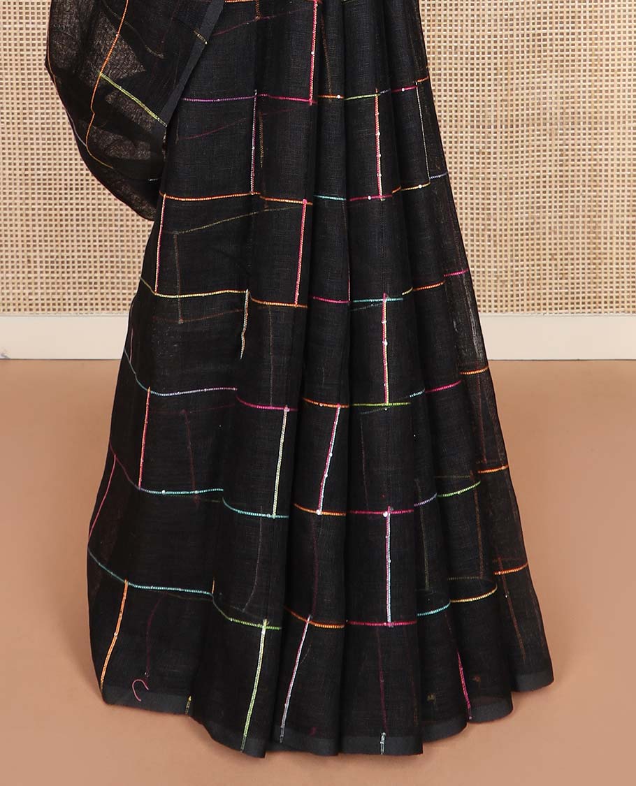 Borderless black checked linen cotton saree, contrast pallu of colorful floral motifs