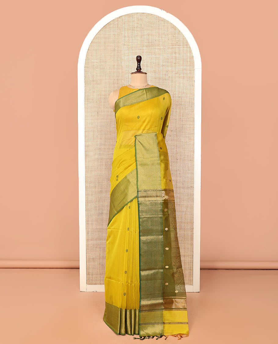 Yellow Maheshwari Cotton Saree, Bedecked with Floral Buttas on Its Body, Complemented by a Contrast Border of Traditional Designs, Pallu Steeped with Buttas, and Paired with a Contrast Blouse