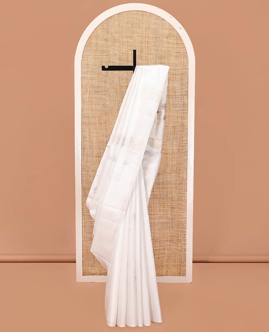 Borderless Cream Mayuri Soft Silk Saree, Sparsely Woven with Pichwai Lotus and Cow Buttas All Over Its Body, Highlighted by Pallu of Pichwai Designs, and Paired with a Matching Blouse