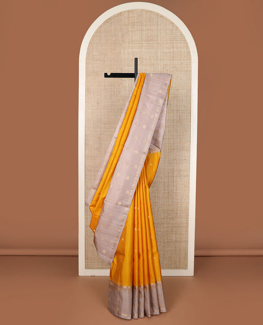 Yellow zari buttas soft silk saree, contrast checked border of annam chakram motifs & zari-rich jaal pallu