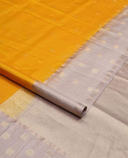 Yellow zari buttas soft silk saree, contrast checked border of annam chakram motifs & zari-rich jaal pallu