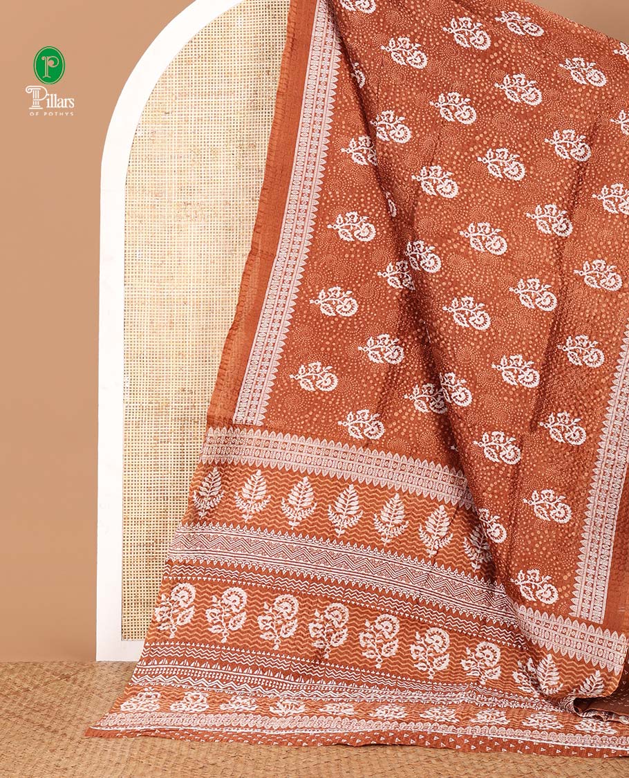 Brown floral printed litchi crushed saree, geometric printed border, floral-geometric printed pallu & triangle motif printed blouse