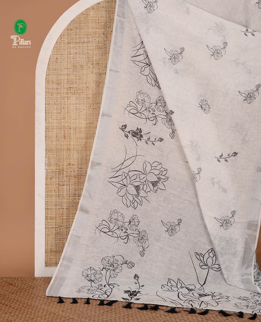 White unique-shaped floral printed linen cotton saree, silver zari border, floral printed pallu & intricate floral print blouse