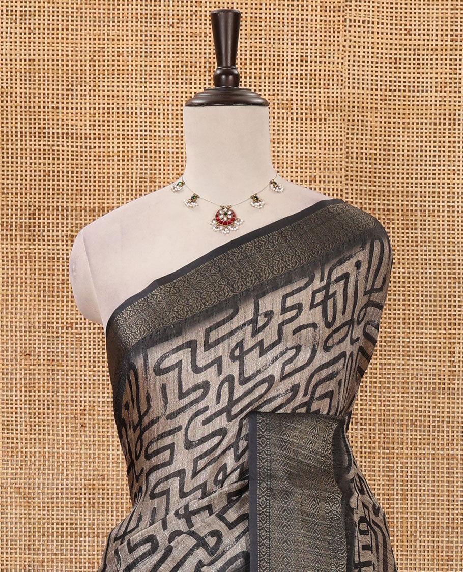Chikku maze-like printed semi-jute saree, contrast geometric zari border, Madhubani-style animals printed pallu, & black blouse of print & zari work