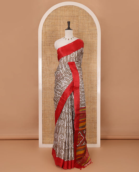 Brown batik-style printed khadi cotton saree, contrast plain border, patola printed pallu & contrast plain blouse
