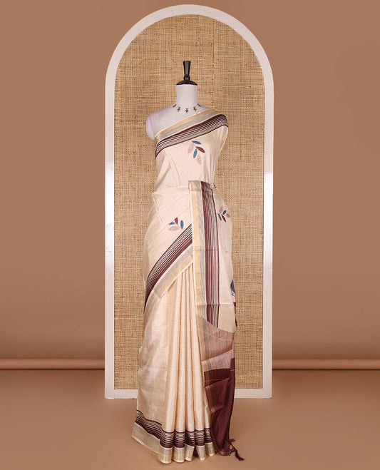 Chikku leaf themed printed soft tussar saree, contrast golden zari horizontally striped border, dual color textured pallu, and contrast plain blouse