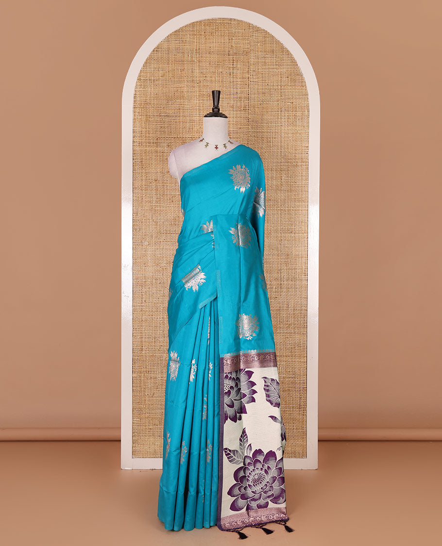 Borderless rama blue floral motifs steeped elite soft silk saree, contrast lotus-like motifs pallu, and contrast buttas blouse