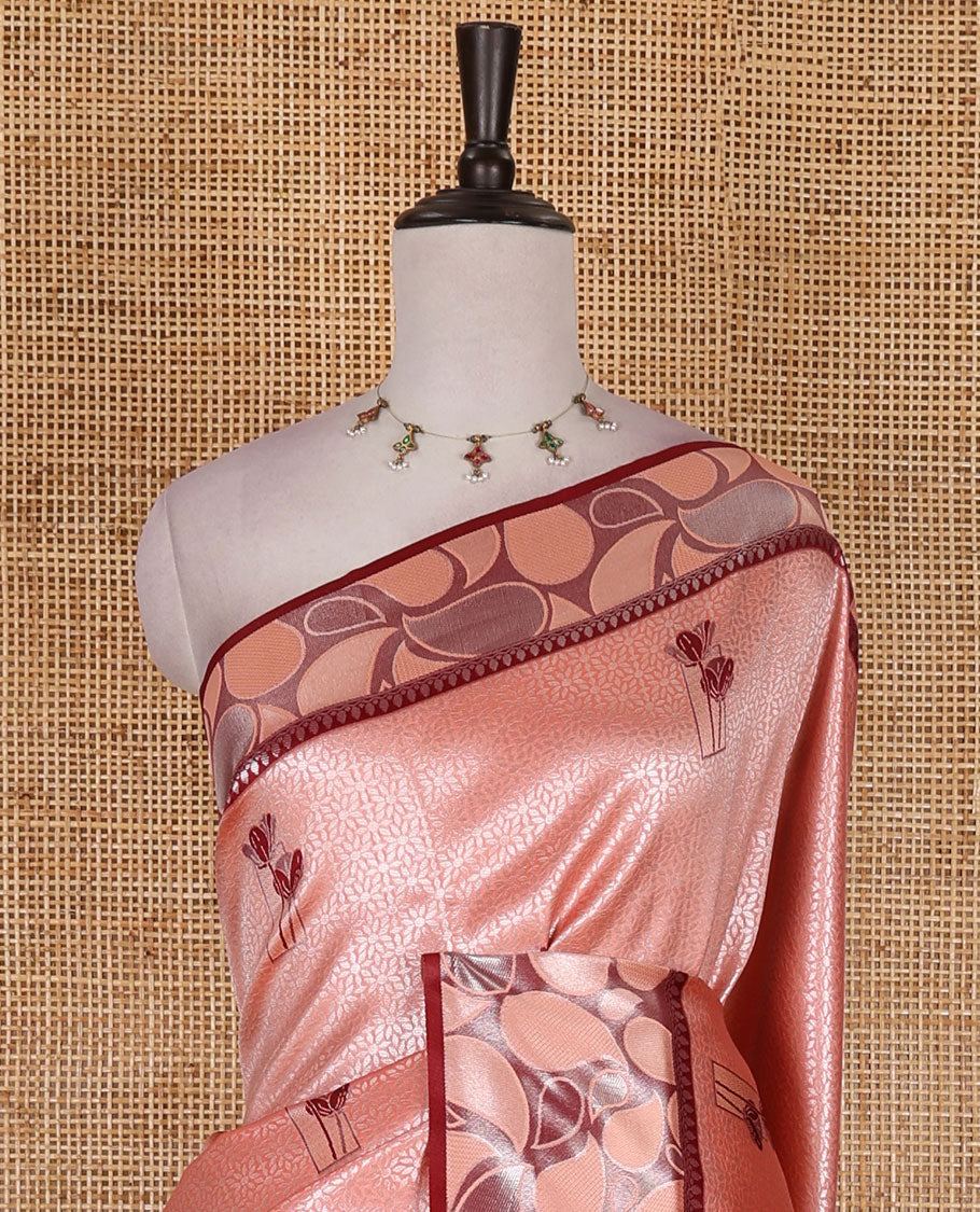 Peach jacquard kanchi silk saree, contrast border, and pallu steeped with paisley motifs with contrast zari design blouse