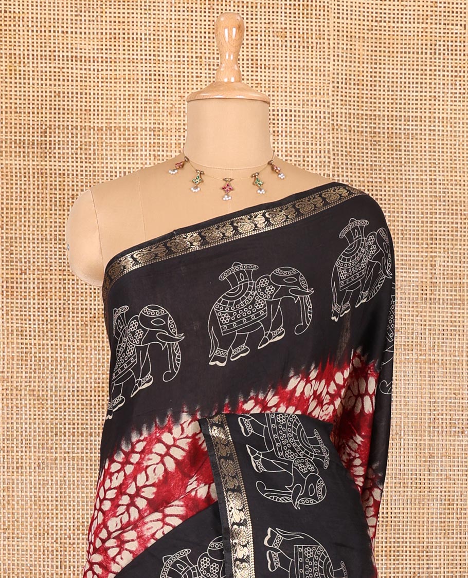 Red shibori printed muslin cotton saree, contrast zari border of elephant motifs print, big elephant printed pallu, and a contrast printed blouse