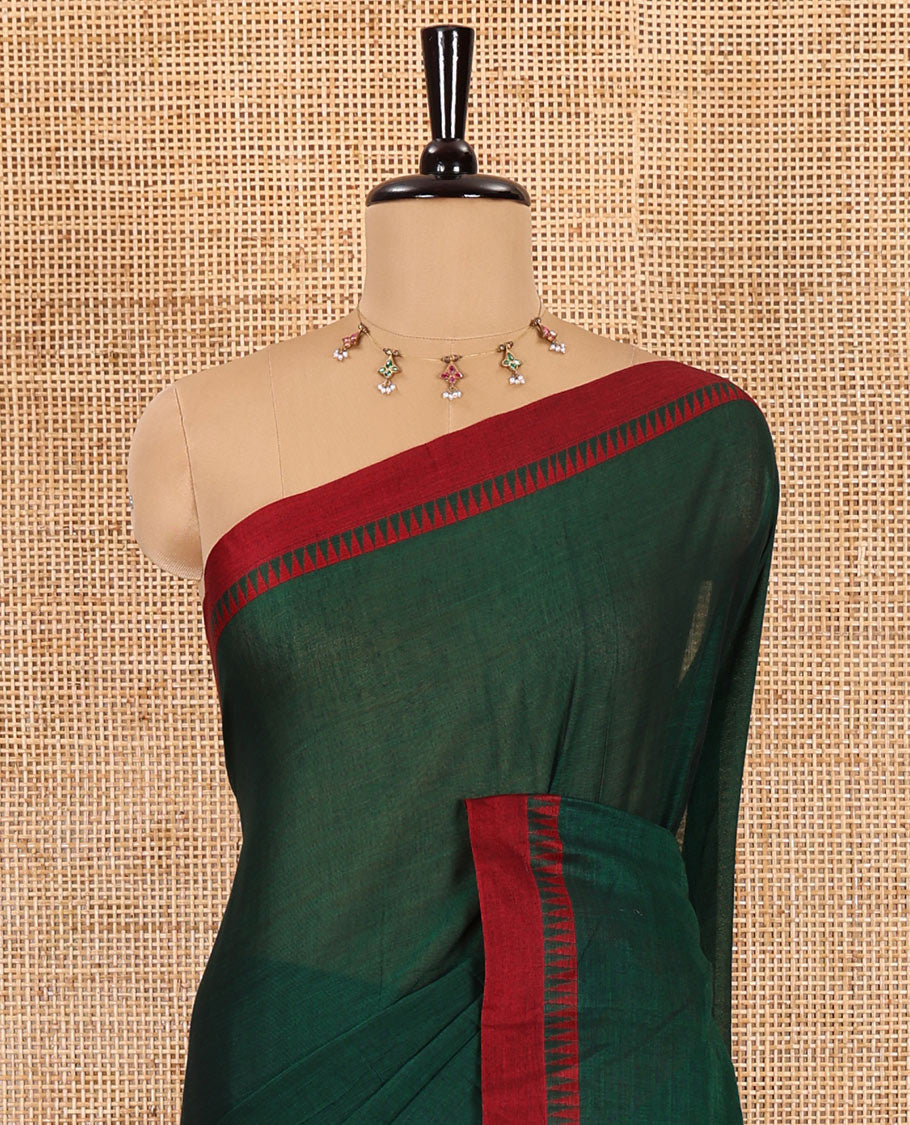 Green plain mercerised cotton saree, contrast temple plain border, striped pallu, and a matching blouse