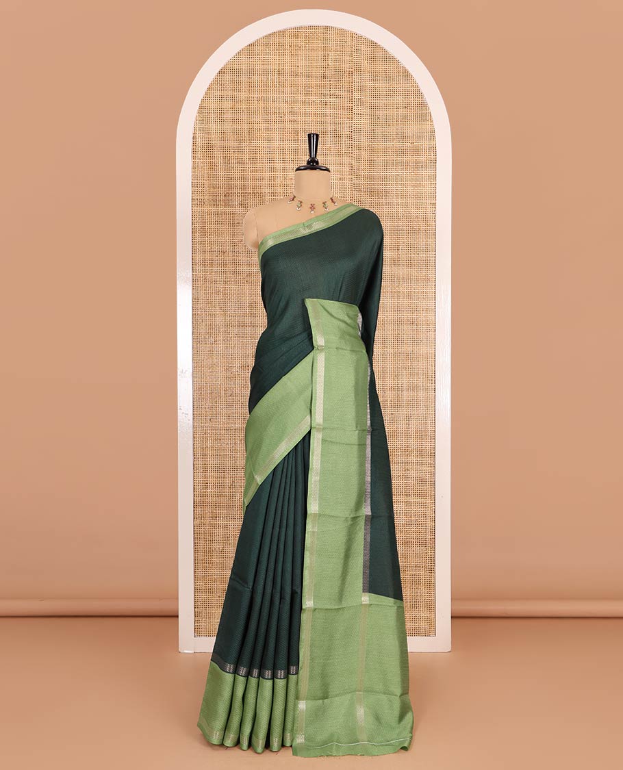 Green embossed moss chiffon saree, contrast traditional rettai pettu border, embossed pallu, and a contrast embossed blouse