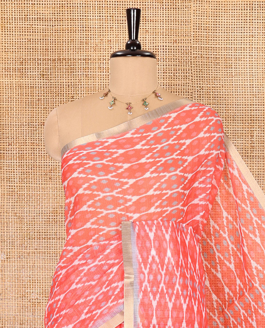 Borderless tomato pink ikkat jaal patterned linen cotton saree, contrast ikkat jaal patterned pallu and ikkat buttas blouse