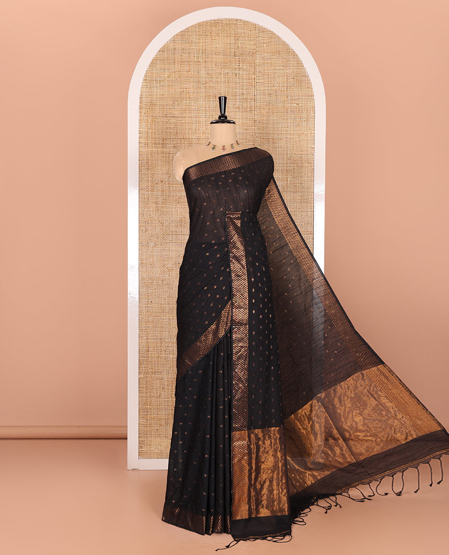 Black Khadi Mul Cotton Saree Beautified with Plus-Shaped Zari Buttas Across Its Body, Featuring a Subtle Zari Border Adorned with Triangle Motifs, a Tissue Pallu, and Complemented by a Running Blouse