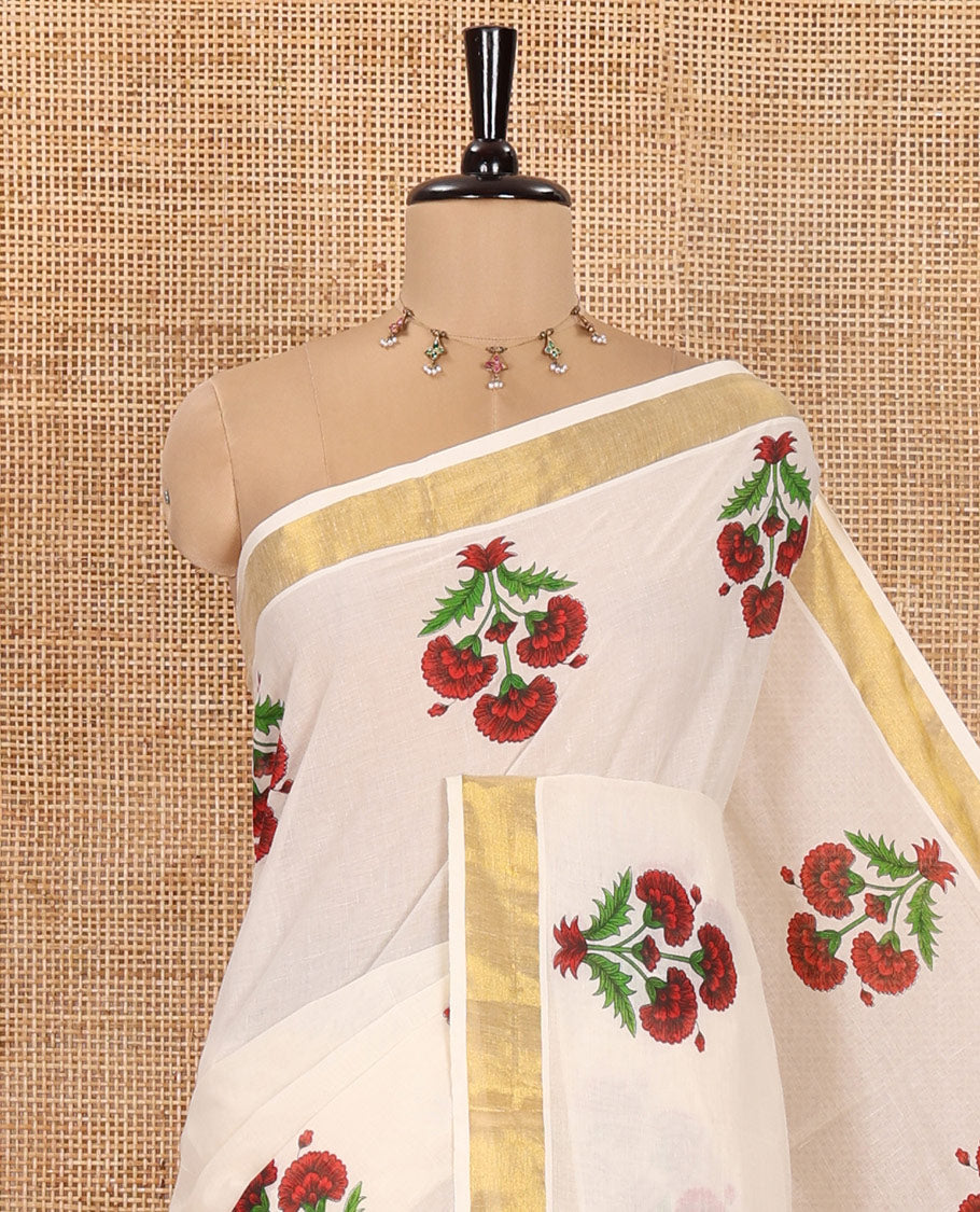 Cream and Red Kerala Cotton Saree, Detailed with Bunch of Floral Motifs Printed on Its Body, Subtle Zari Border, Pallu Features a Big Bunch of Floral Motifs Print, and Paired with a Matching Blouse