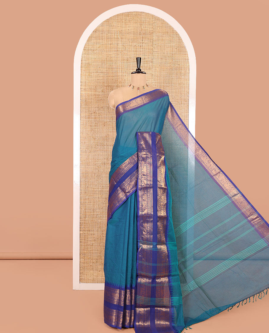 Blue Plain Chettinad Cotton Saree, Complemented by a Contrast Traditional Rettai Pettu Temple Border of Peacock-Elephant Designs, Subtly Striped Pallu, and Paired with a Matching Blouse