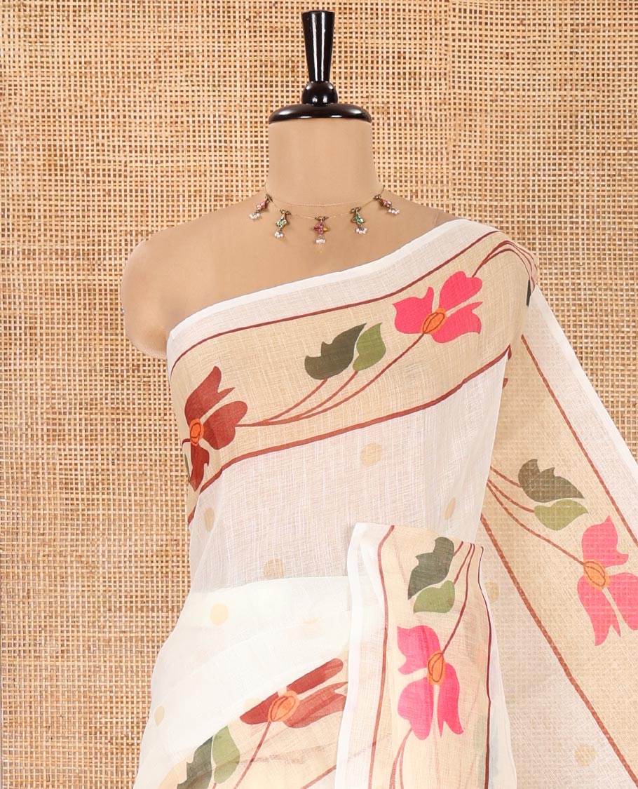 Cream Linen Cotton Saree, Subtly Sparkled with Zari Buttas All Over Its Body, Highlighted by Contrast Floral Creeper Design Border, Subtle Pallu and Paired with a Striped Blouse