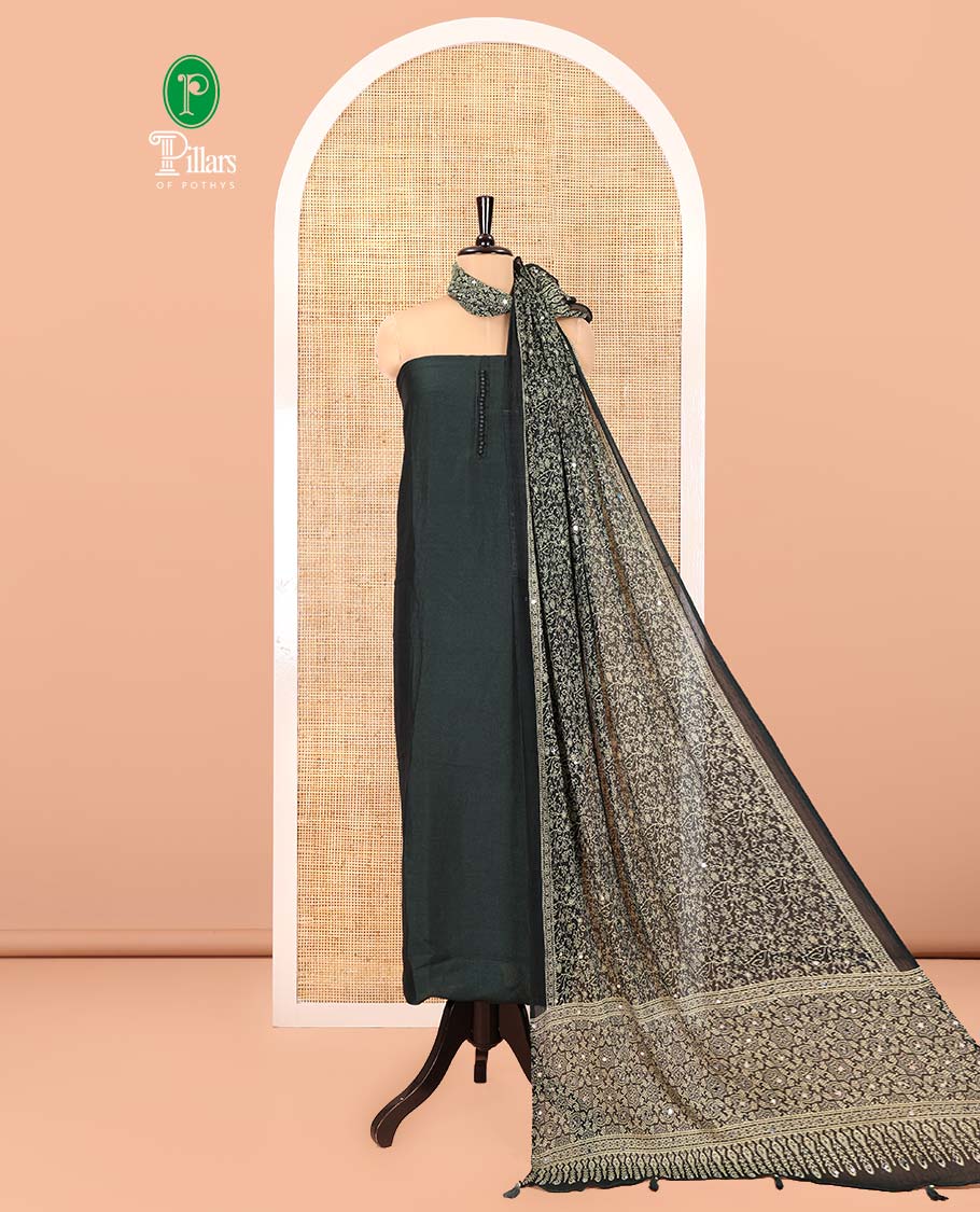 Bottle Green Material Chudidar Set, Subtly Woven with Pom-Pom Potli Neck Vichitra Silk Top, a Plain Santoon Bottom, Paired with Crushed Georgette Dupatta of Ajrakh Print and Mirror Work