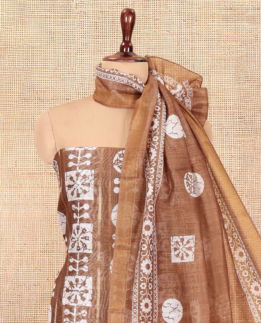 Brown Chanderi Material Chudidar Features Batik Printed Top, a Matching Bottom, and Batik Printed Dupatta