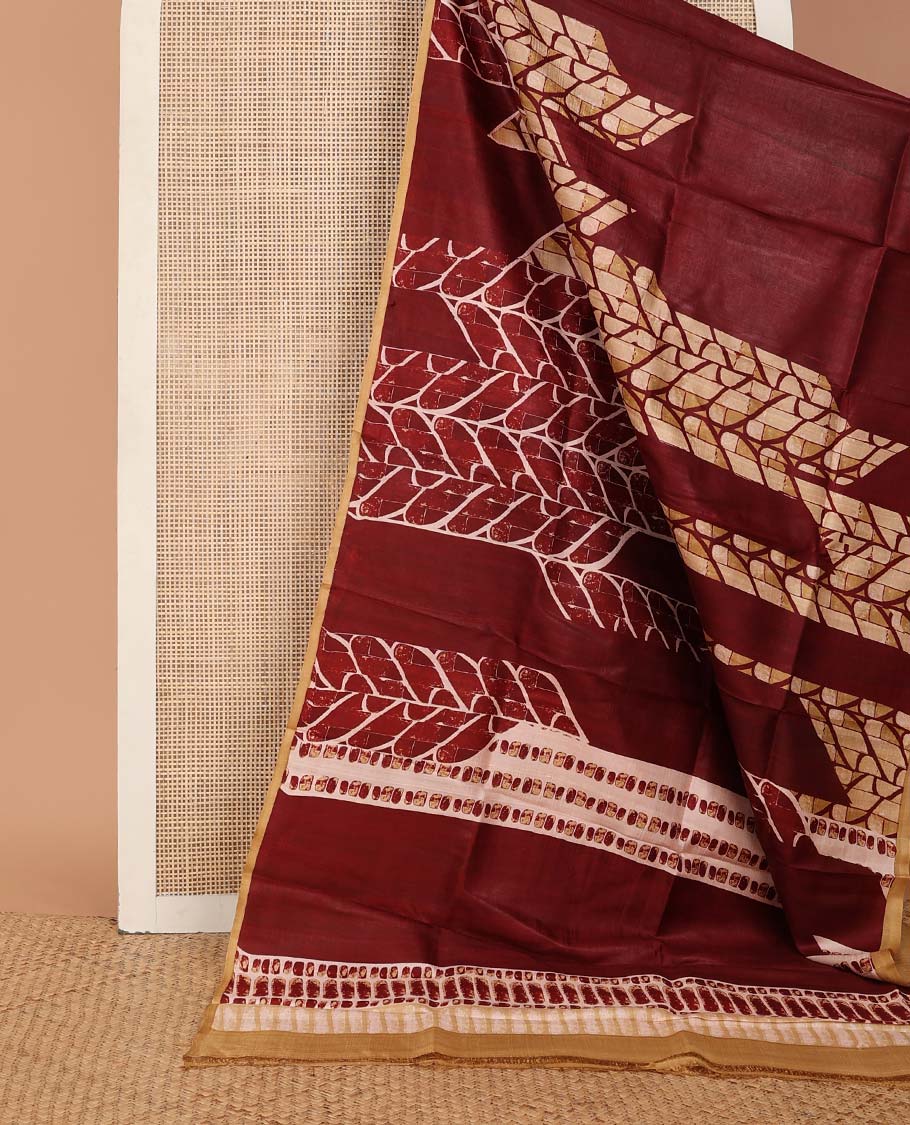 Maroon uniquely geometric printed silk saree with a contrast plain border & printed pallu