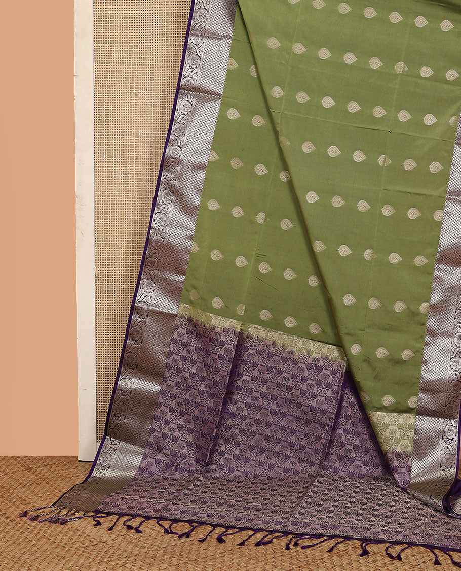 Olive green zari buttas soft silk saree, contrast diamond and floral creeper border, and pallu of lotus floral designs