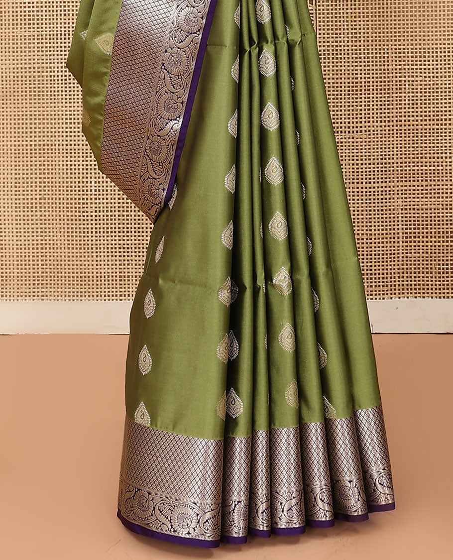 Olive green zari buttas soft silk saree, contrast diamond and floral creeper border, and pallu of lotus floral designs