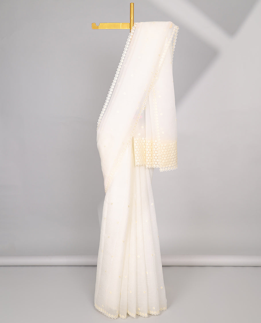 Pink Crushed Tissue saree with scallop motif border and intricate motif embroidery pallu